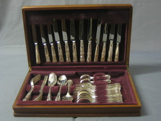 A canteen of Kings Pattern silver plated flatware by Vines contained in a teak finished box