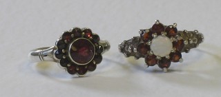 A silver dress ring set red stones and 1 other silver dress ring