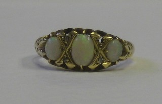 An 18ct gold dress ring set 2 oval cut opals