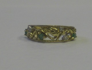 An Eastern gold dress ring set emeralds and diamonds