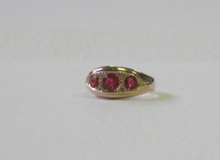 A gold dress ring set 3 synthetic rubies