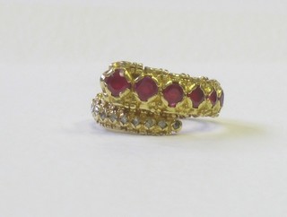 A gold dress ring in the form of a snake set rubies and diamonds