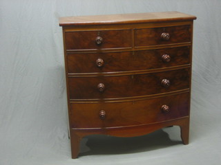 A Victorian mahogany bow front chest of 2 short and 3 long drawers with tore handles, raised on bracket feet 39"
