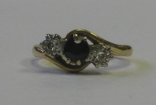 An 18ct gold dress ring set sapphires and 2 diamonds