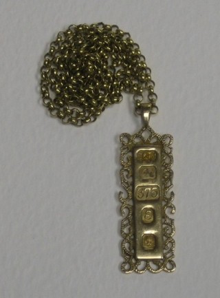 A 9ct gold ingot pendant hung on a belcher link chain