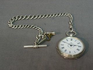 An open faced pocket fob watch contained in a silver case hung on a curb link chain