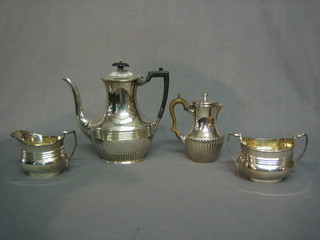 A silver plated coffee pot with reeded decoration, do. hotwater jug together with a cream jug and sugar bowl