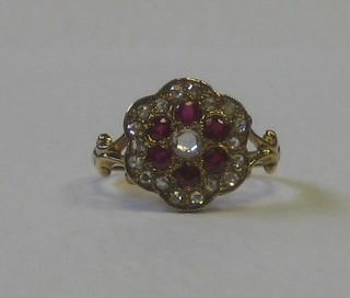 A lady' 18ct yellow gold floral shaped dress ring set rubies and diamonds 