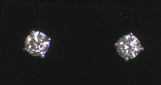 A pair of gold and diamond ear studs, approx 1ct