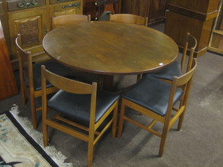 A Danish circular teak dining table 48", together with 6 dining chairs