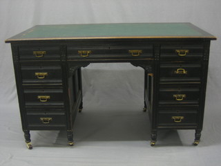 An Edwardian Edwards & Roberts ebonised kneehole pedestal desk with writing surface above 1 long and 8 short drawers 48"