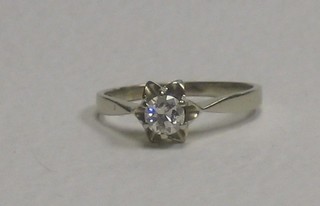 A lady's 18ct gold dress ring set a solitaire diamond