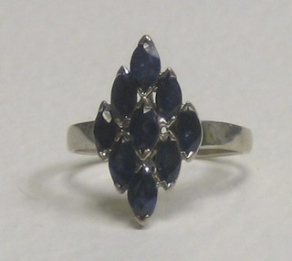 A 14ct gold dress ring set blue stones