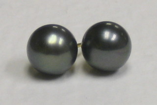 A pair of black "pearl" earrings