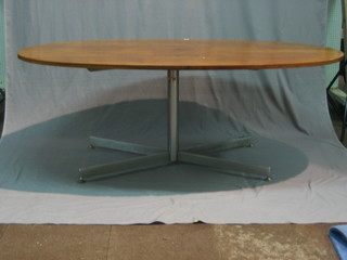 A 1960's rosewood oval dining table raised on a chromium base 76"