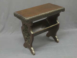An Oriental carved rectangular occasional table the base fitted a book trough 26"