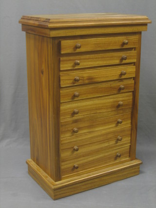 A Georgian style bleached mahogany pedestal chest of 8 long drawers with tore handles raised on a platform base 23"