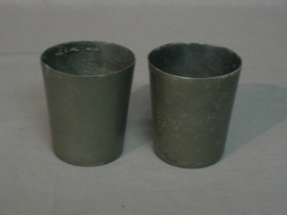 A pair of Victorian pewter half pint beakers, the base marked Henry Leddell & Co London