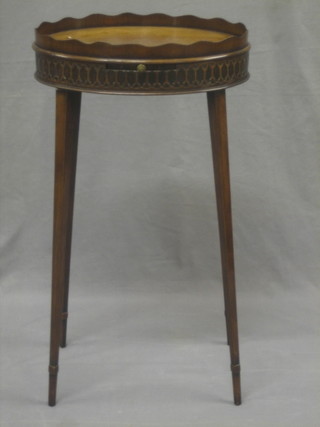 A Georgian mahogany oval urn table with reeded border, blind fret work frieze, raised on square tapering supports 14"