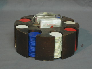 A set of 20th Century gaming counters contained in a wooden holder