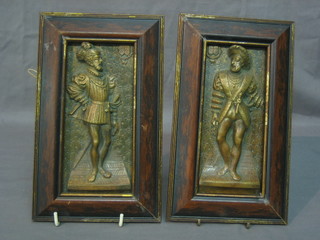 A pair of brass wall plaques of Elizabethan figures 7" x 3"