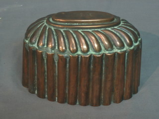 A Victorian oval reeded copper jelly mould (slight split to seam) 6"