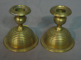 A pair of brass stub shaped candlesticks 4"