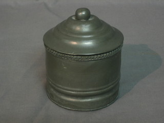 A 19th Century cylindrical pewter tobacco jar and cover by James Dixon, the base marked 66 3"