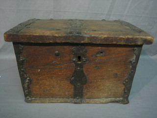 An 18th Century oak and iron bound strongbox with hinged lid, the lid engraved IM 17" (locked - no key)