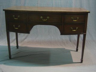 A 19th Century mahogany bow front sideboard fitted 1 long drawer flanked by 4 short drawers, raised on square tapering supports ending in spade feet 48"