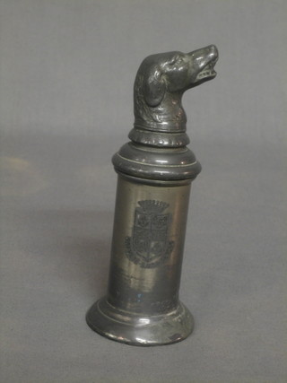 A 19th Century Continental pewter string box of cylindrical form, the head in the form of a dog with open mouth with armorial decoration 5.5"