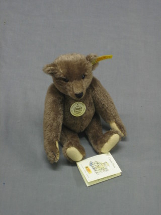 A reproduction 1905 Steiff brown teddy bear with articulated limbs 10"