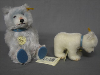 A reproduction 1929 Steiff blue teddy bear with articulated limbs 8" together with a Steiff polar bear 6" complete with carrier bag