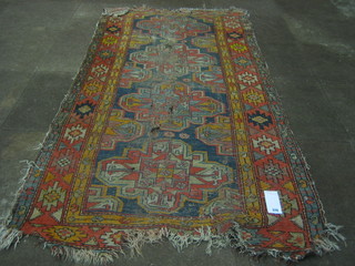 A cream rug (heavily worn and holed)