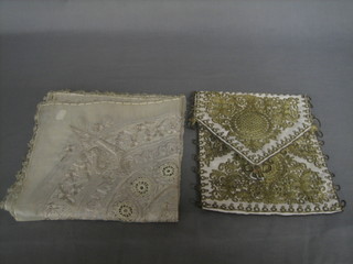 An Eastern bag together with an Eastern embroidered tablecloth