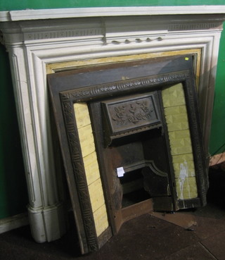 A Victorian cast iron drawing room fire place complete with surround and insert 60"