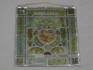 A Victorian square stained glass panel with floral decoration marked Diomed 1780 16"