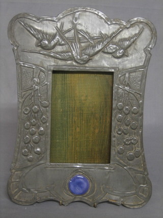 An Art Nouveau embossed pewter photograph frame decorated diving birds inset circular hardstone 12"