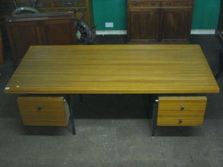 A 1960's Designer wooden laminate finished desk fitted 1 long and 2 short drawers 79"