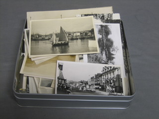 A quantity of various black and white postcards, photographs etc