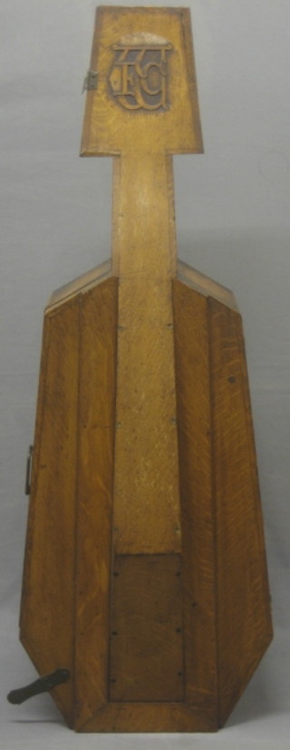 A 19th/20th Century carved oak cello case with monogramme