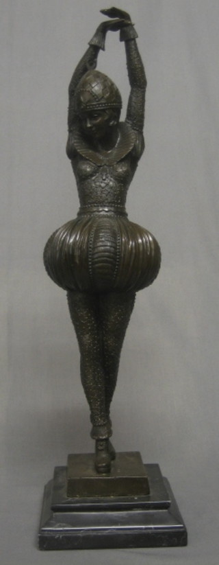 A reproduction bronze figure of a standing Russian Dancer, raised on a marble base 20"