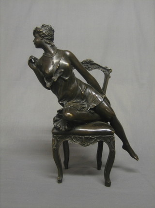 An Art Nouveau style bronze figure of a seated lady 16"