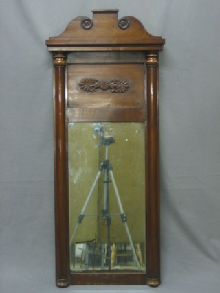 A 19th Century rectangular plate chimney mirror contained in a mahogany frame, flanked by a pair of columns 46"