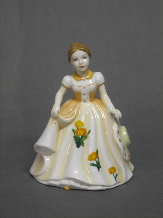 A Royal Doulton figure - October