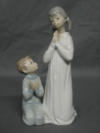 A Lladro figure No 4779 Teaching to Pray