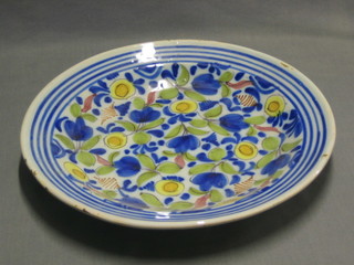 A Delft pottery plate with floral decoration, reverse marked RC 12"