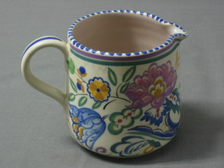 A Poole Pottery jug with floral decoration, the base impressed Poole England 230 (handle f and r) and a  cylindrical preserve jar and cover (lid cracked) 3"