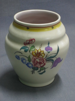 A circular Poole Pottery vase with floral decorated, base impressed Poole England 210 4"