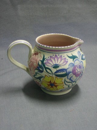 A Poole Pottery jug with floral decoration, base impressed Poole England 316 4 1/2"